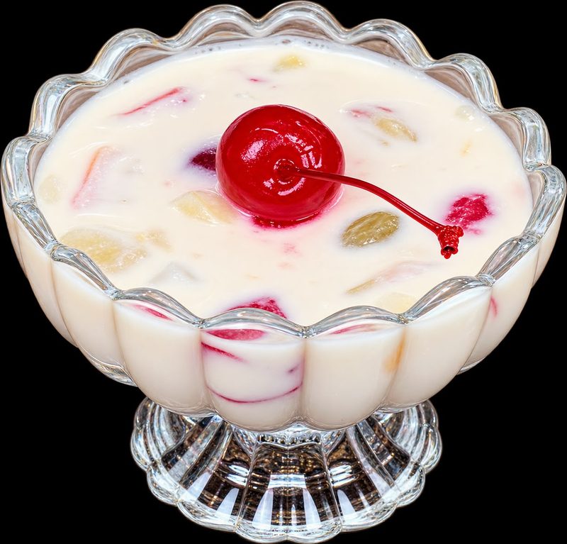 Fruit cream dessert with a cherry on top